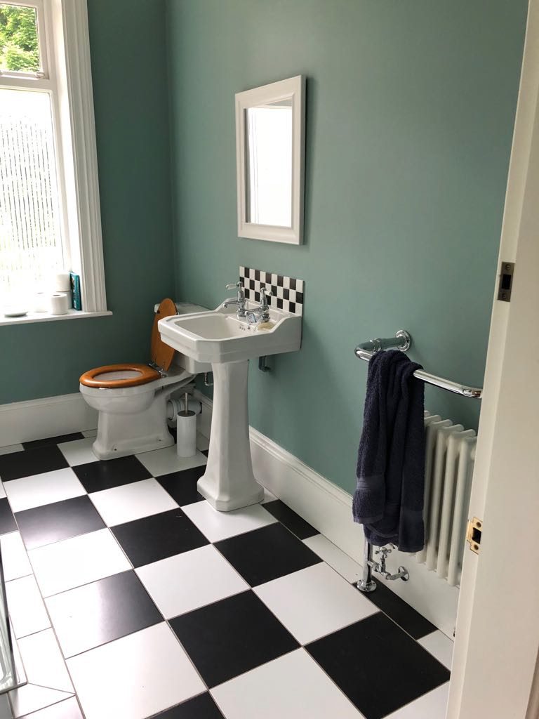 Newly fitted bathroom with chequered floor